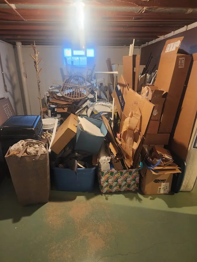 Roll-off dumpster container at job site for 2 Yard Dumpster Rental in Cottage Grove